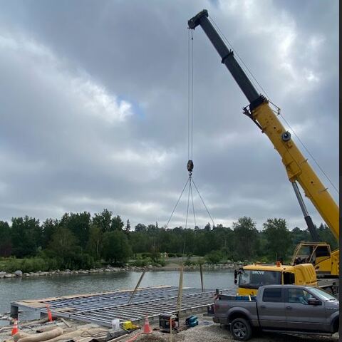 Infrastructure: Custom-fabricated structural steel dock and mounting system for the Bow River. Features heavy-duty CWB-certified structural framing with corrosion-resistant finishes designed for high-moisture environments. 

