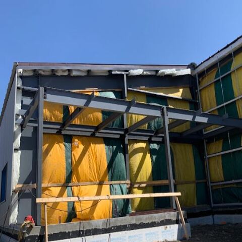 "Structural Steel: Precision fabrication and installation of secondary structural steel framing for a commercial building envelope. 

