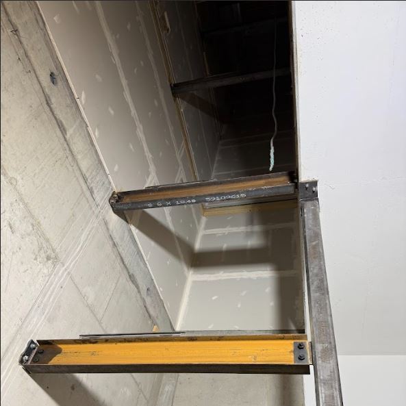 "Parkade Structural Support & Dividers: Installation of heavy-gauge structural steel columns and divider beams for multi-level hoistway support. All members are precision-aligned and secured with high-tensile bolting and CWB-certified field welds.
