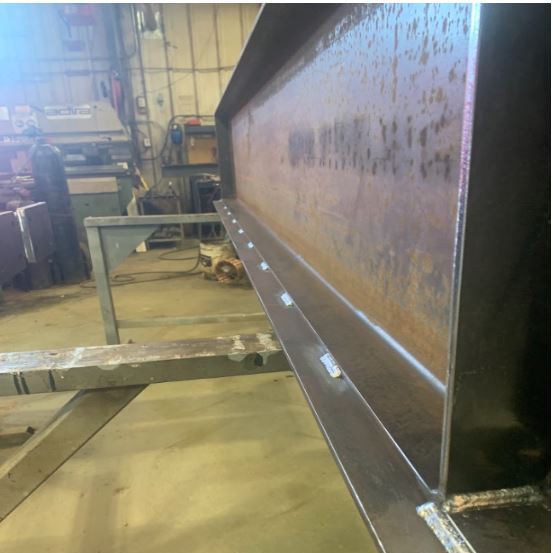"Weld quality detail. All structural connections are ground to bare metal, inspected to CWB W59 standards, and immediately treated for corrosion resistance."
