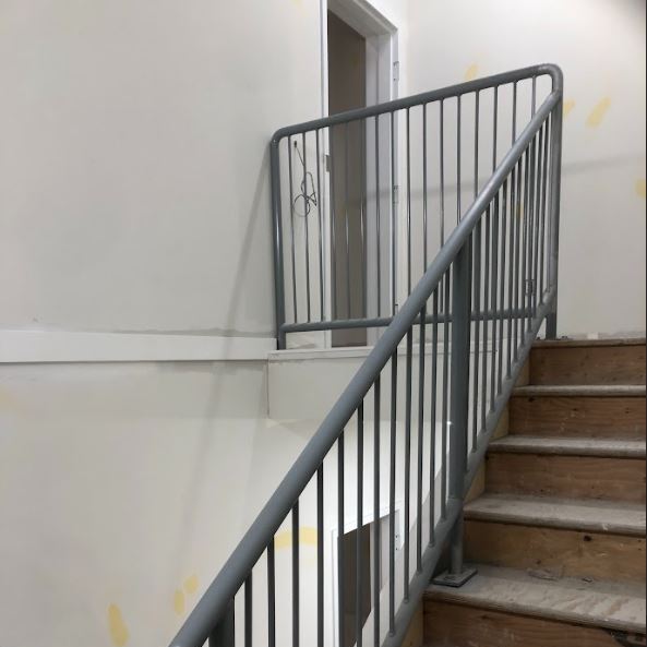  Custom-fabricated steel handrail system featuring ergonomic grip profiles and high-strength mounting brackets. Engineered for Alberta Building Code